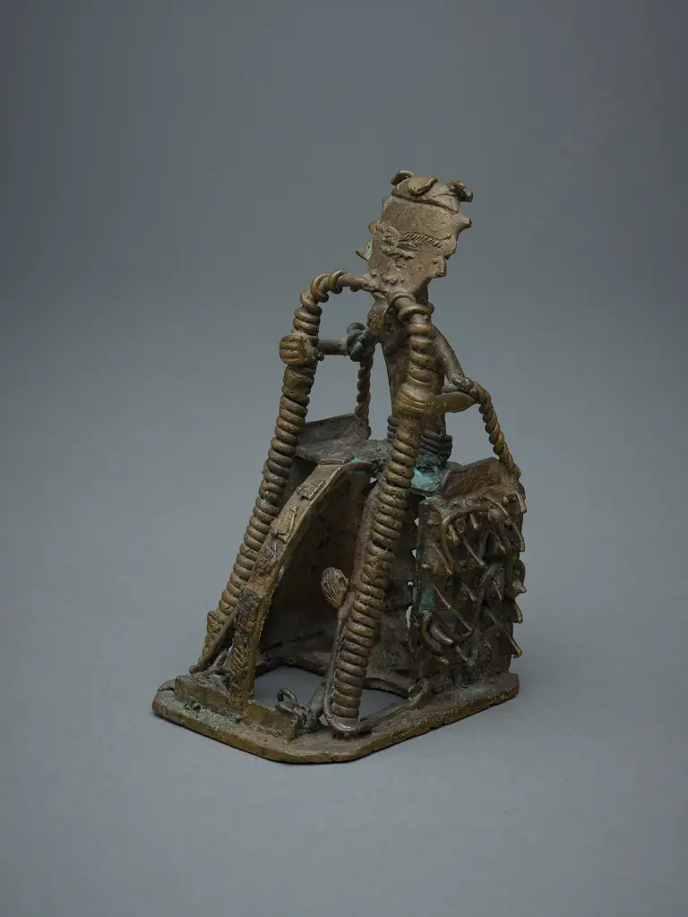 African brass and wire-formed seated figure, Image 1++